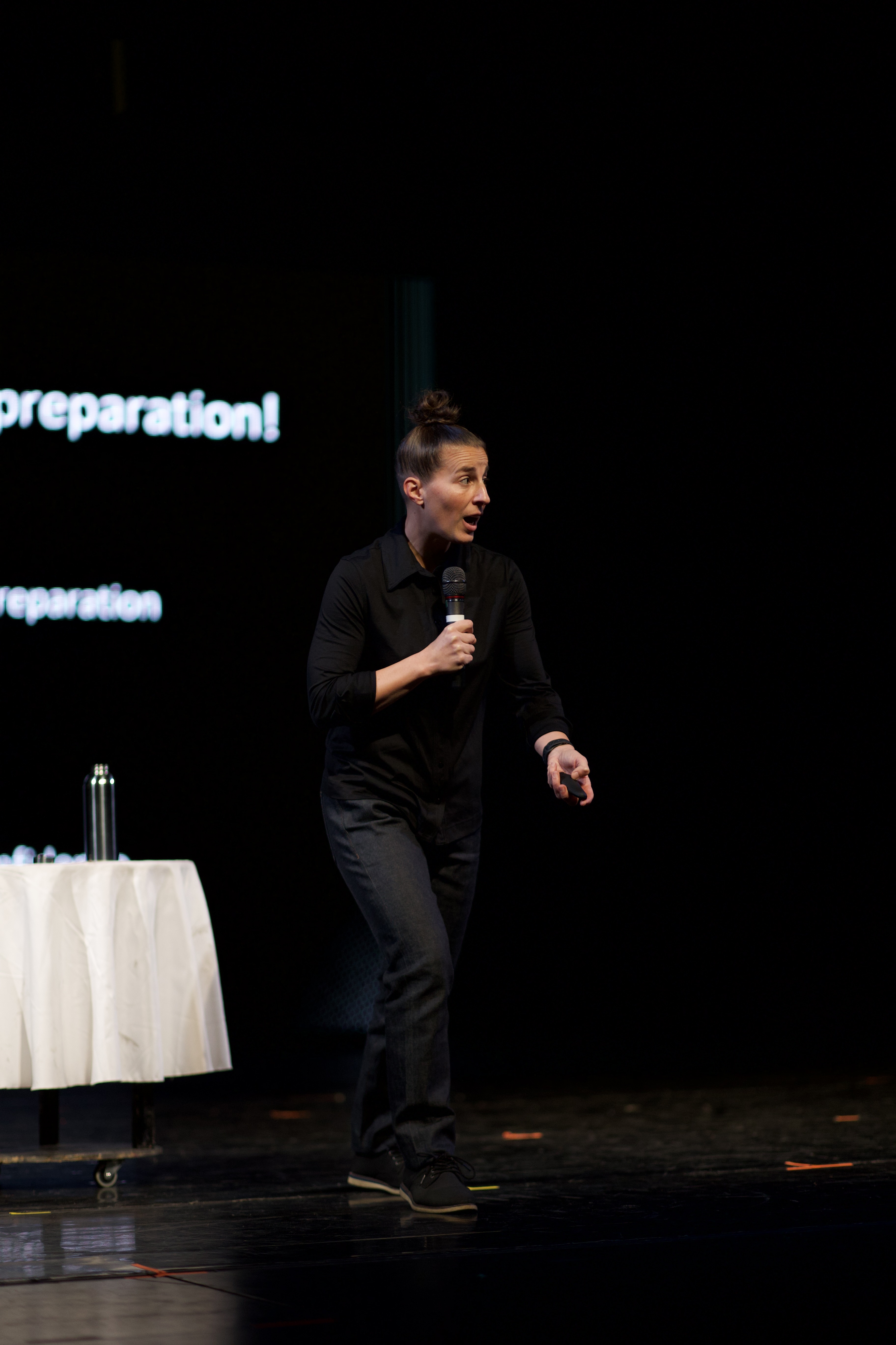 Christen Strags delivering keynote speech on stage at corporate event